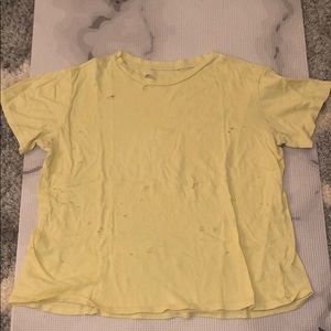 Yellow boxy women’s tee shirt with holes
